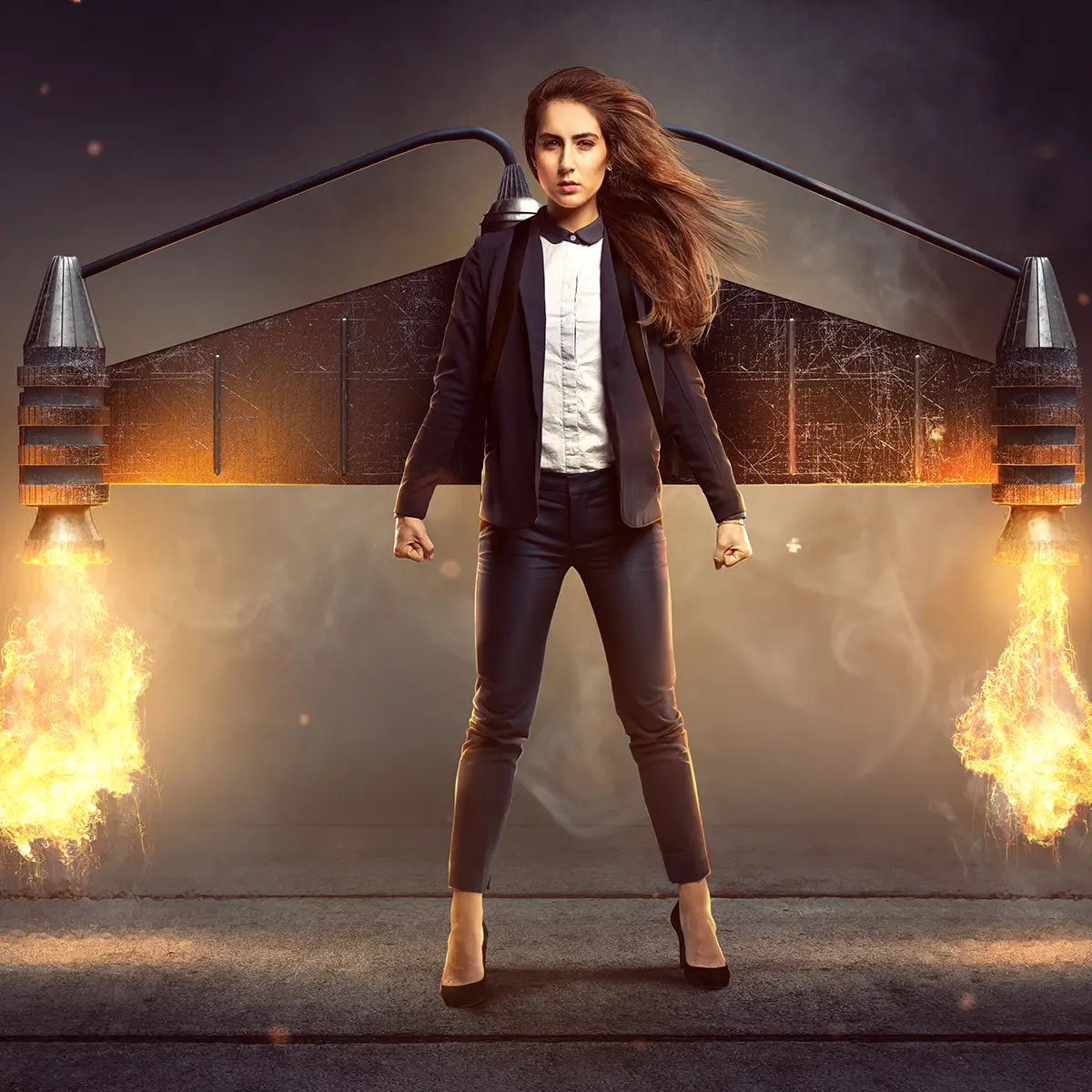 A woman stands confidently with a determined expression, wearing a business suit and high heels. She has a pair of large, futuristic jet engines strapped to her back, emitting flames and smoke as if ready for takeoff. Her stance is powerful, with fists clenched and legs slightly apart, giving the impression of strength and readiness for action. The dramatic lighting and fiery effects add to the dynamic and empowering atmosphere of the image. This image symbolises a motivation champion, embodying drive, ambition, and the unstoppable energy to achieve great things and overcome challenges.